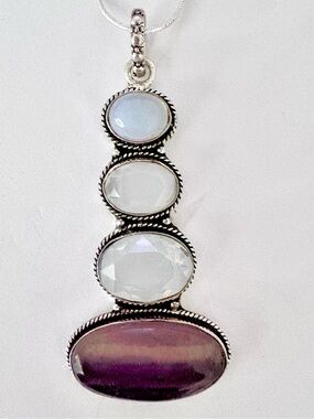 3 inch , 925 marked,, Fluorite stone on the bottom and 3 Opalite on the top.